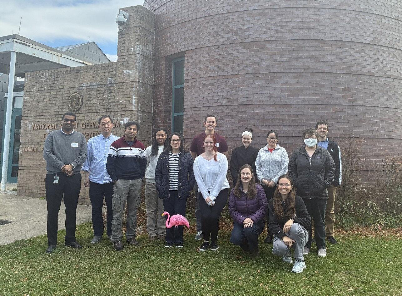 A group photo in front of a brick building